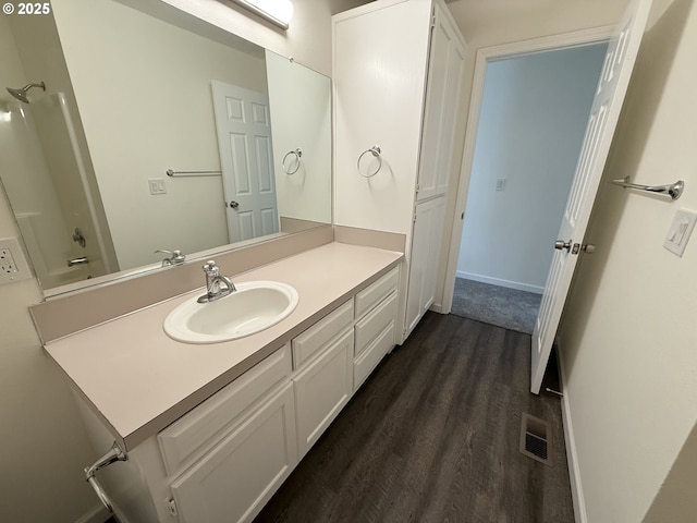 bathroom with vanity and wood-type flooring