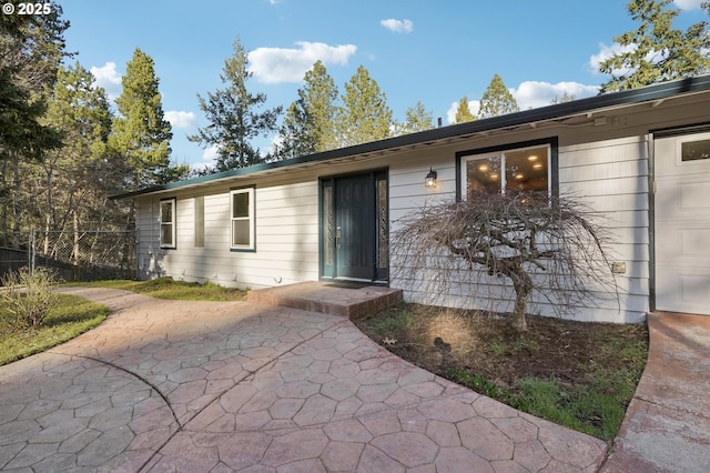 doorway to property featuring a patio