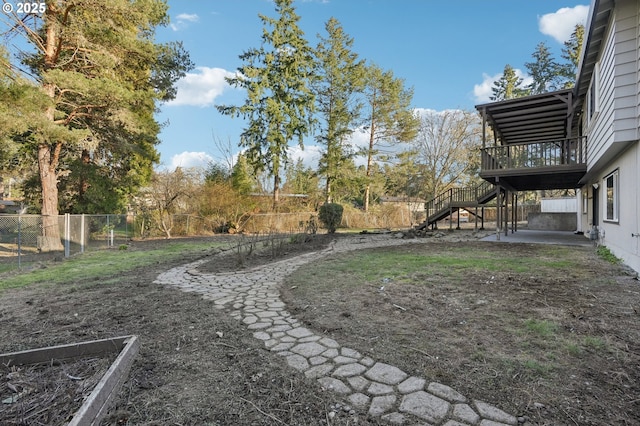 view of yard featuring a wooden deck