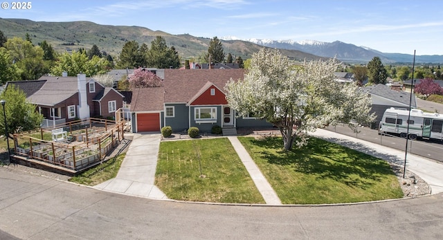 205 Hillcrest Dr, Baker City, OR 97814 - view of front facade with driveway, a garage, a front lawn, a mountain view, and a residential view
