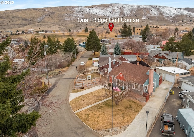 drone / aerial view featuring a mountain view and a residential view
