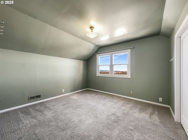 bonus room with lofted ceiling, visible vents, and carpet