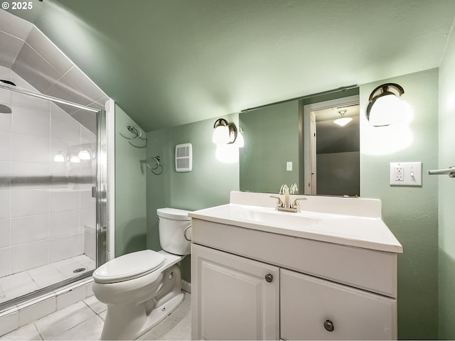 bathroom with a stall shower, vaulted ceiling, vanity, and toilet