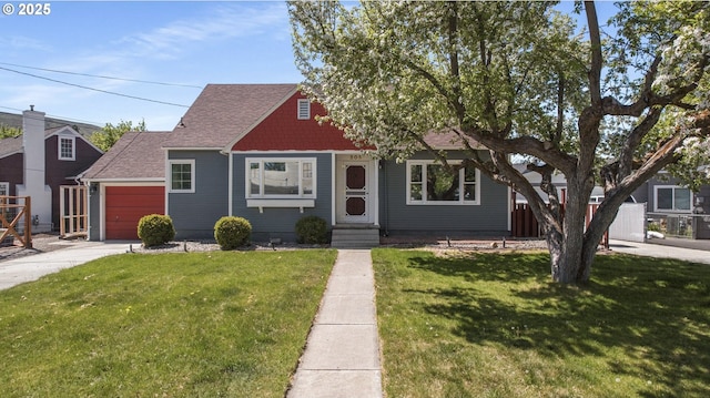205 Hillcrest Dr, Baker City, OR 97814 - view of front of home featuring an attached garage, a front yard, concrete driveway, and roof with shingles