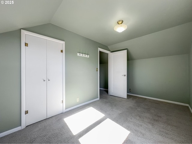 bonus room with lofted ceiling, carpet, and baseboards