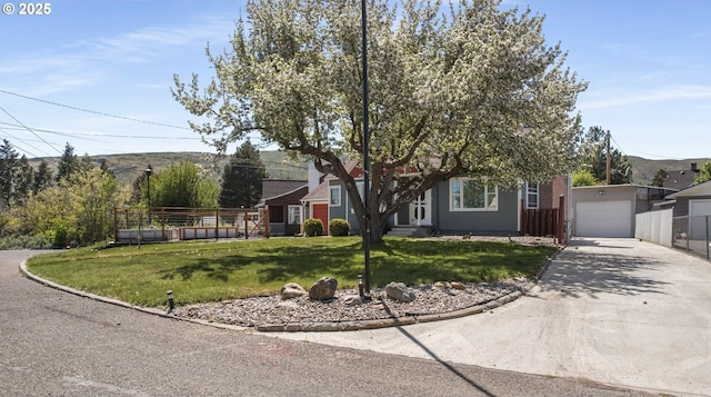 205 Hillcrest Dr, Baker City, OR 97814 - view of property hidden behind natural elements featuring driveway, a garage, and an outbuilding