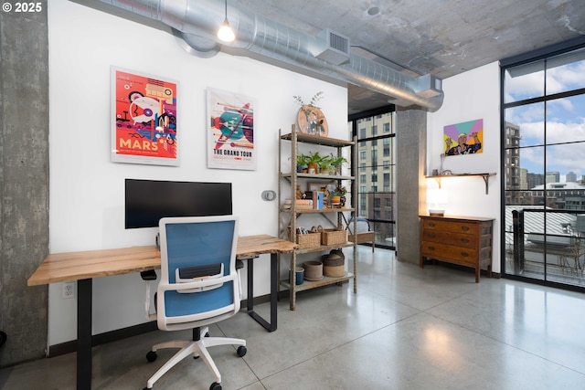 1030 NW 12th Ave Unit 431, Portland, OR 97209 - home office with expansive windows and concrete floors