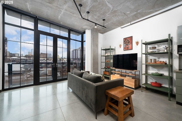 1030 NW 12th Ave Unit 431, Portland, OR 97209 - living room featuring a view of city, floor to ceiling windows, and french doors