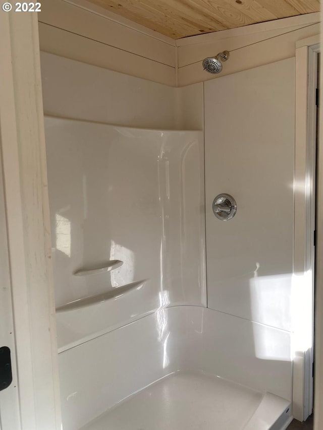 full bathroom with a shower and wooden ceiling