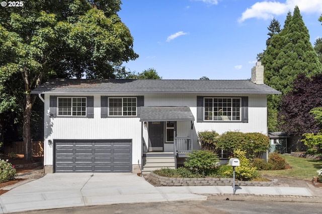 18478 Rose Ct, West Linn, OR 97068 - bi-level home featuring driveway, a chimney, a garage, and roof with shingles