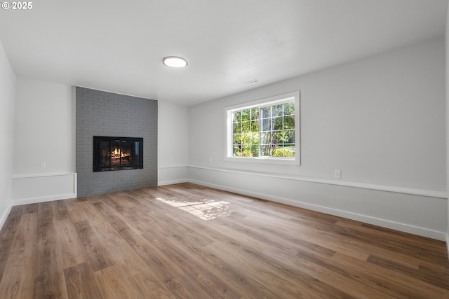 18478 Rose Ct, West Linn, OR 97068 - unfurnished living room featuring a fireplace and wood finished floors