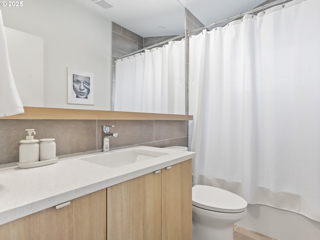 full bathroom with vanity, shower / tub combo, decorative backsplash, and toilet