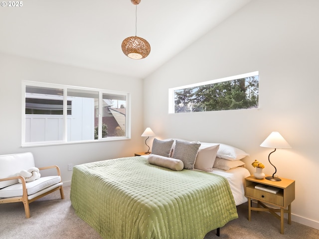 carpeted bedroom featuring vaulted ceiling