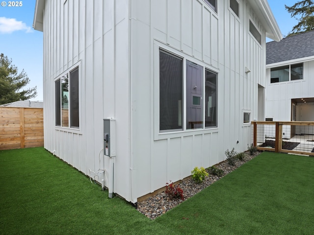 view of side of home featuring a yard