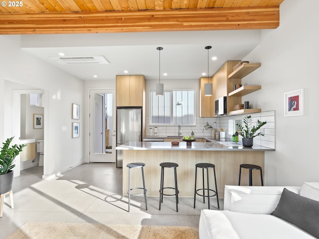 kitchen with wood ceiling, tasteful backsplash, kitchen peninsula, pendant lighting, and stainless steel appliances