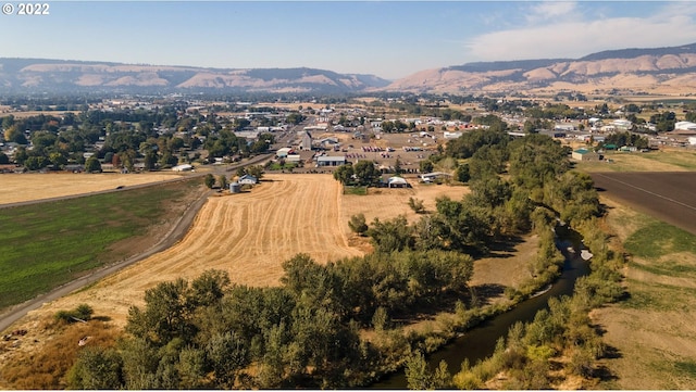 birds eye view of property featuring a mountain view