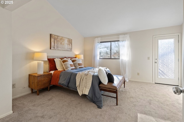 bedroom featuring lofted ceiling, access to exterior, and light carpet