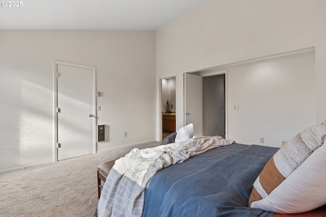 carpeted bedroom featuring vaulted ceiling