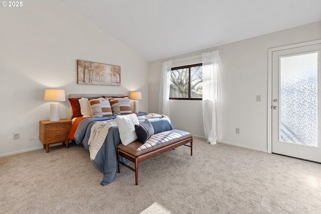 carpeted bedroom with lofted ceiling