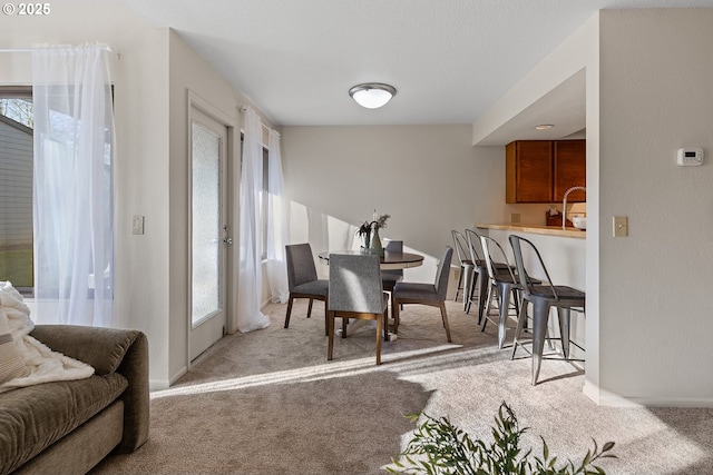 view of carpeted dining space