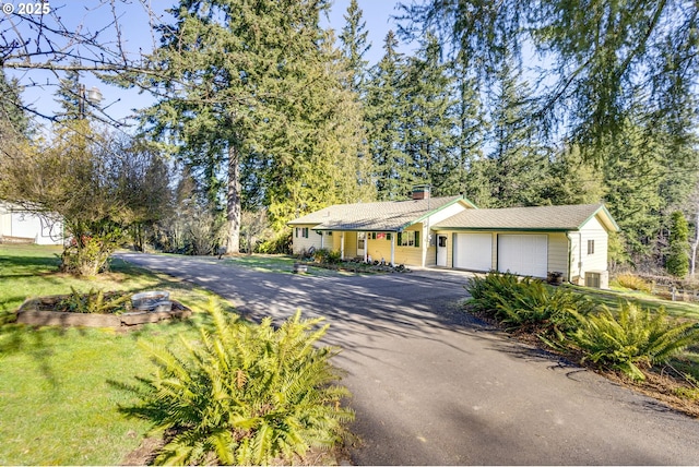 ranch-style house with a front lawn and a garage