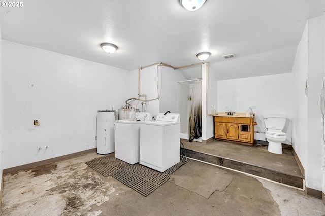 81 Mathany Rd, Carson, WA 98610 - laundry room with separate washer and dryer, water heater, and baseboards