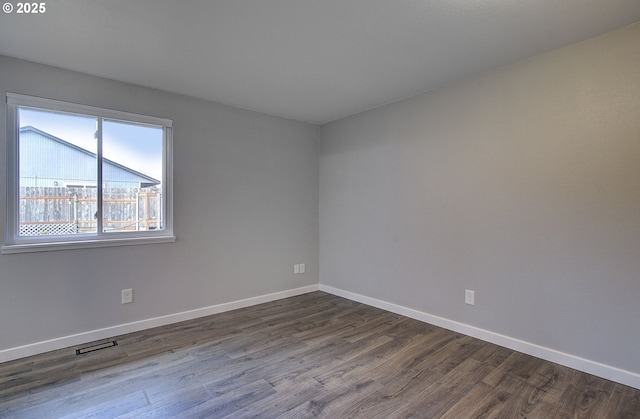 empty room featuring hardwood / wood-style flooring