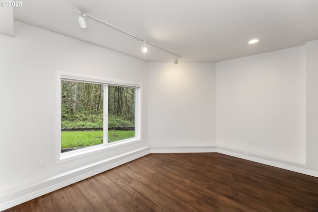 1916 NW Runnymeade Ct, Portland, OR 97229 - spare room with track lighting, dark wood finished floors, baseboards, and recessed lighting