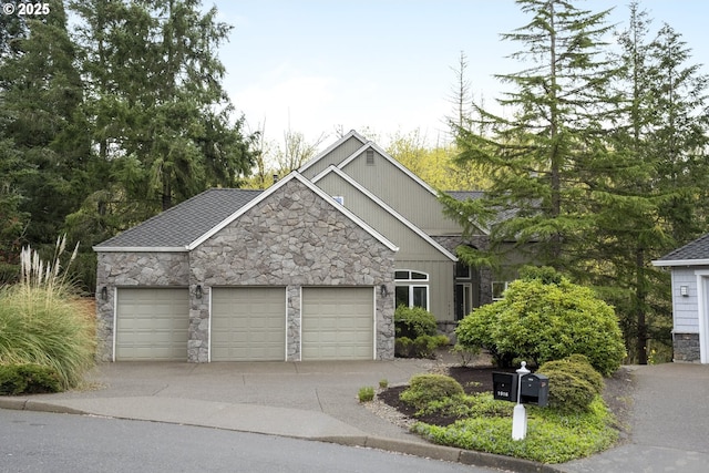 1916 NW Runnymeade Ct, Portland, OR 97229 - view of front facade featuring stone siding, an attached garage, and a shingled roof