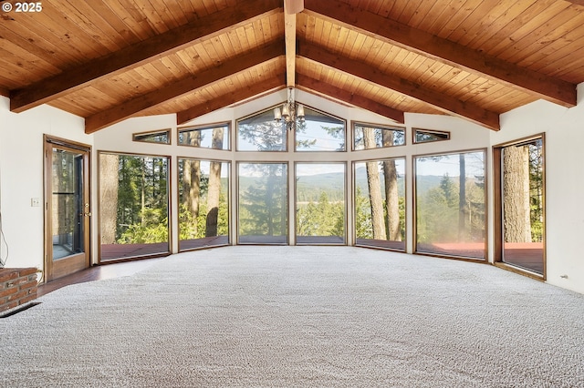 unfurnished sunroom with high vaulted ceiling, a chandelier, beam ceiling, and carpet