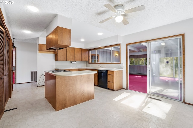 kitchen featuring a textured ceiling, visible vents, dishwasher, brown cabinets, and light countertops
