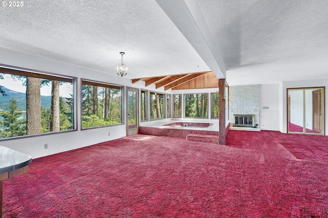 unfurnished sunroom featuring plenty of natural light, heating unit, an inviting chandelier, and a jacuzzi