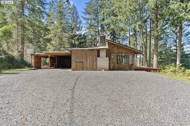 exterior space with gravel driveway