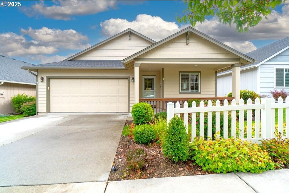 view of front of house featuring a garage and covered porch