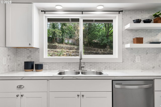kitchen with a sink, open shelves, dishwasher, and decorative backsplash