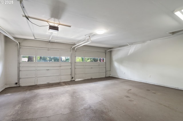 garage featuring a garage door opener