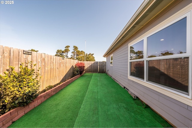 view of yard with a fenced backyard