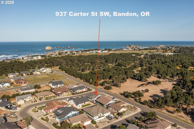 bird's eye view featuring a residential view and a water view