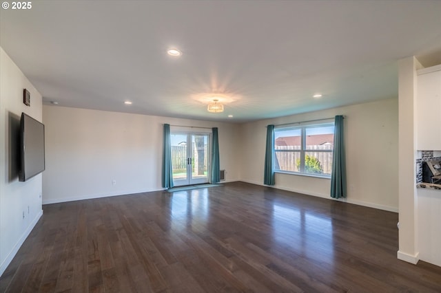 unfurnished room featuring dark wood finished floors, baseboards, visible vents, and recessed lighting