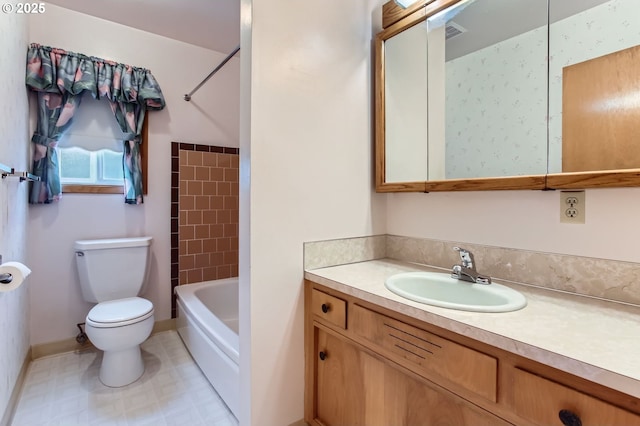 full bathroom with toilet and vanity