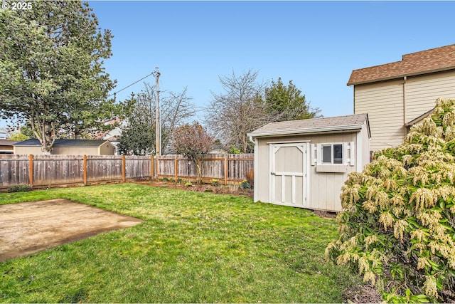 view of yard featuring an outbuilding, a patio area, a fenced backyard, and a storage shed