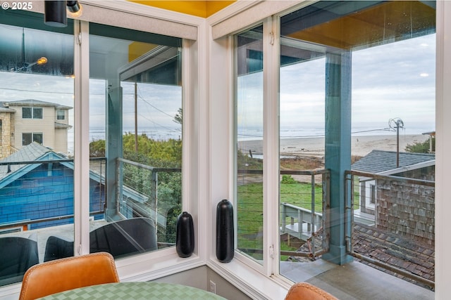 doorway to outside featuring a water view and a wealth of natural light