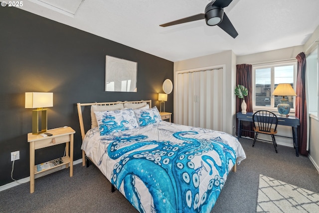 carpeted bedroom with a closet and ceiling fan