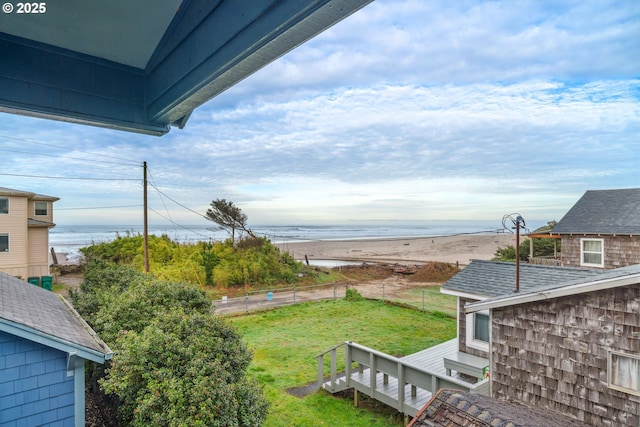 view of yard with a deck with water view