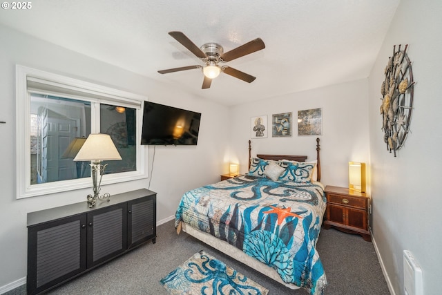 bedroom with ceiling fan and carpet floors