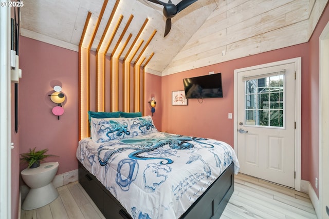 bedroom featuring vaulted ceiling and light hardwood / wood-style flooring