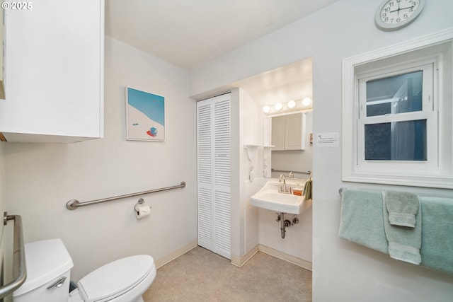 bathroom featuring sink and toilet