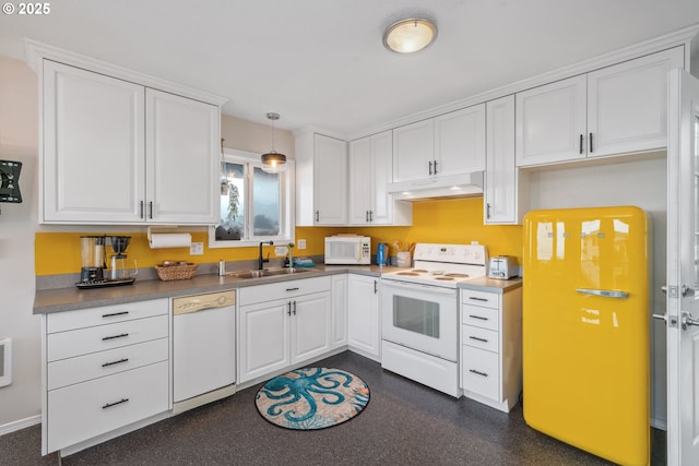 kitchen featuring white cabinetry, sink, white appliances, and decorative light fixtures