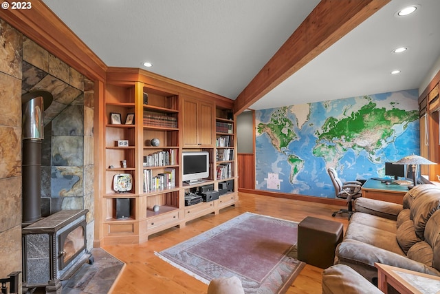 22091 S Ridge Rd, Oregon City, OR 97045 - living room featuring a wood stove, light hardwood / wood-style flooring, and lofted ceiling with beams