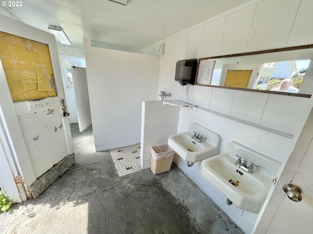 bathroom with sink and concrete flooring